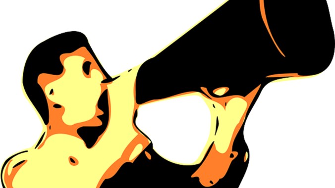 man shouting into megaphone 